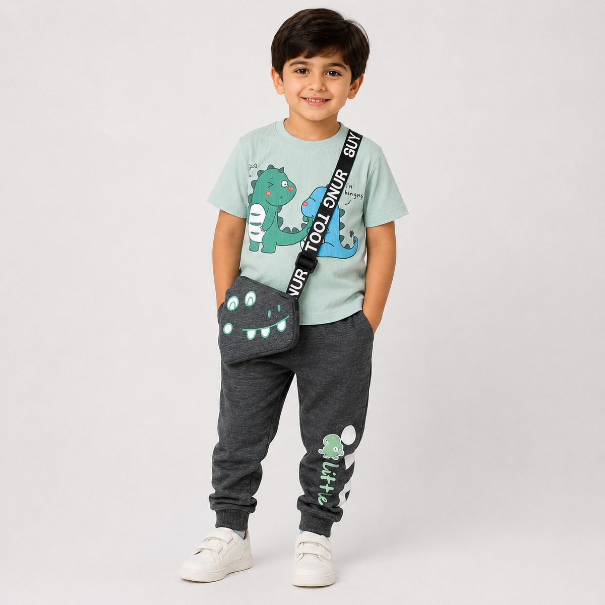 Hayoor boys' mint dinosaur graphic t-shirt with charcoal jogger trousers and crossbody bag